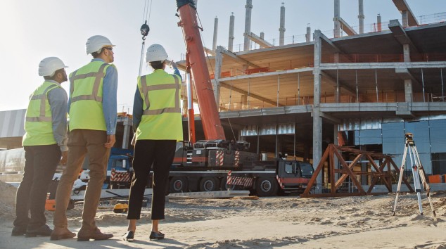 Workers standing in a construction site