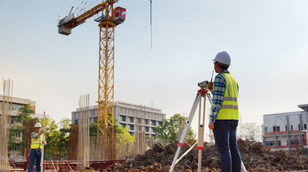 Construction site with a surveyor