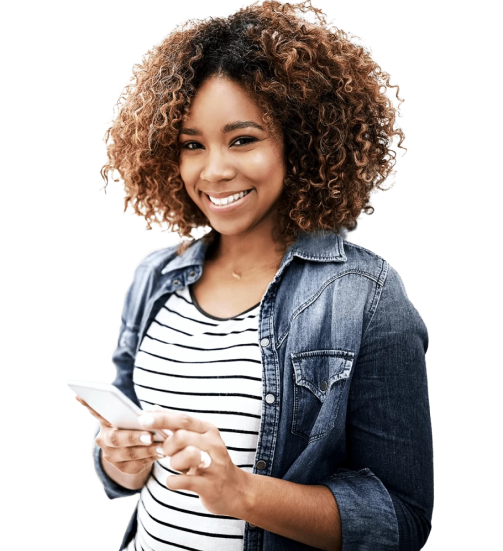 young woman holding a phone and smiling at the camera