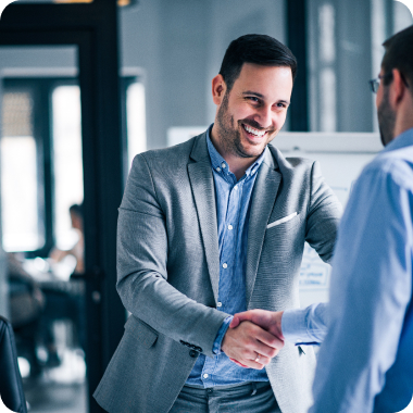 Business man shaking hands and smiling
